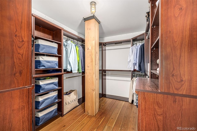 2955 Inca St Unit 1H, Denver, CO 80202 - spacious closet featuring wood-type flooring and ornate columns