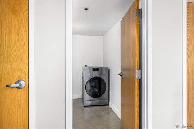 2955 Inca St Unit 1H, Denver, CO 80202 - laundry room with washer / dryer and baseboards