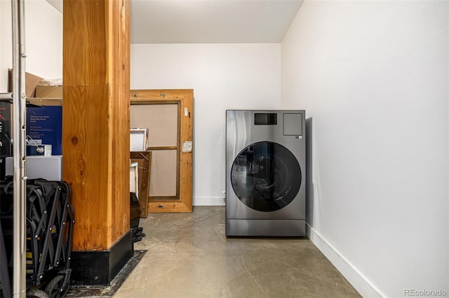 2955 Inca St Unit 1H, Denver, CO 80202 - washroom with washer / clothes dryer and baseboards