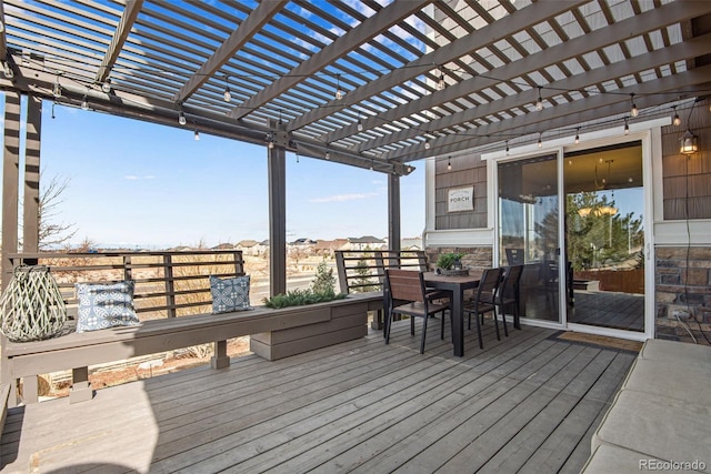 deck with outdoor dining area