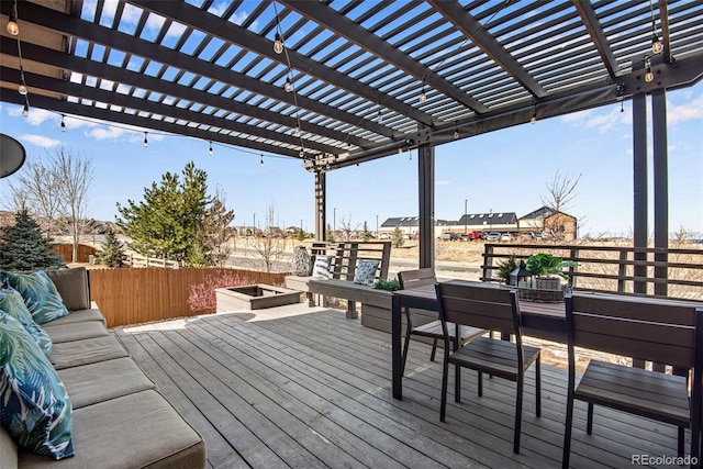 deck with outdoor dining space and a pergola