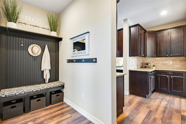 mudroom featuring recessed lighting, light wood-type flooring, and baseboards