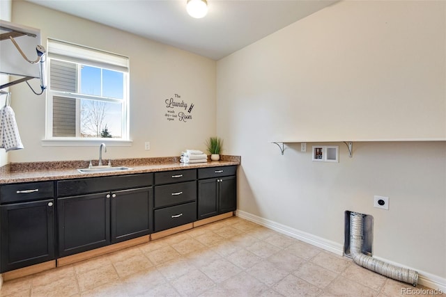 laundry area featuring baseboards, washer hookup, cabinet space, electric dryer hookup, and a sink