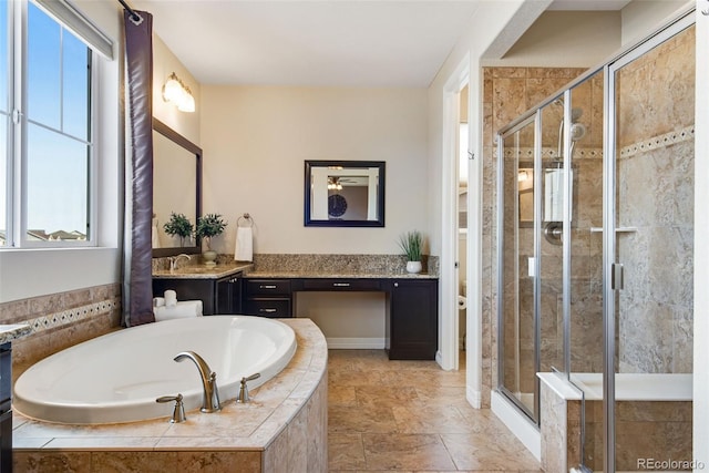 bathroom with toilet, a stall shower, vanity, and a bath