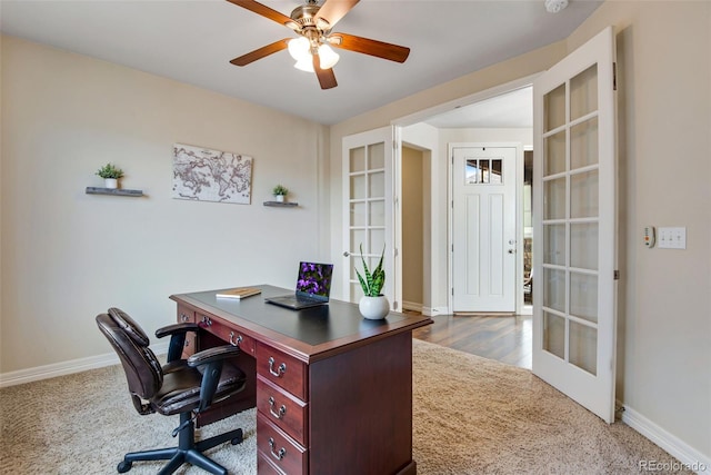 office space with carpet, french doors, baseboards, and ceiling fan