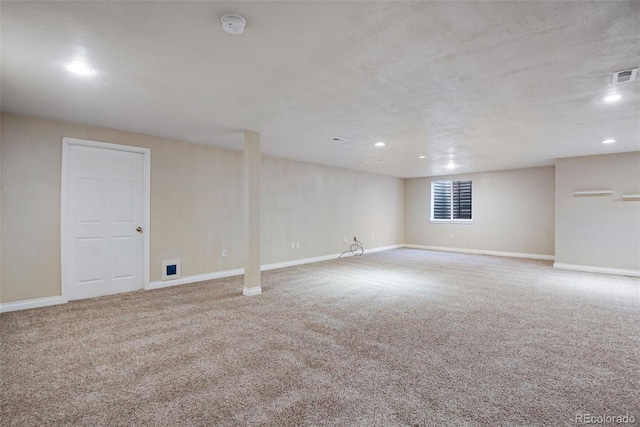 basement with recessed lighting, visible vents, baseboards, and carpet