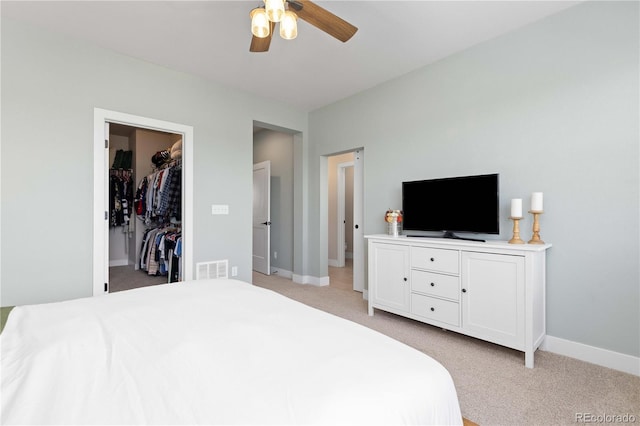 13729 Vallejo Loop, Broomfield, CO 80023 - bedroom featuring light colored carpet, a spacious closet, and ceiling fan