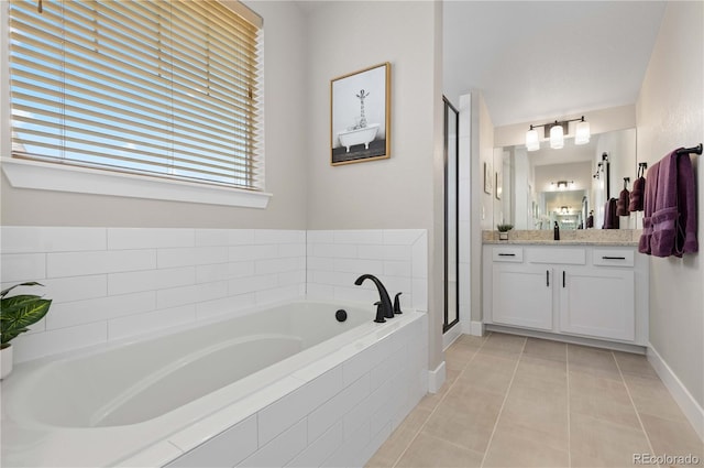 13729 Vallejo Loop, Broomfield, CO 80023 - full bath featuring vanity, tile patterned floors, a bath, and a shower stall