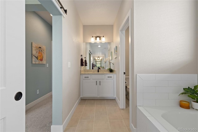 13729 Vallejo Loop, Broomfield, CO 80023 - full bathroom featuring a garden tub, vanity, and tile patterned floors