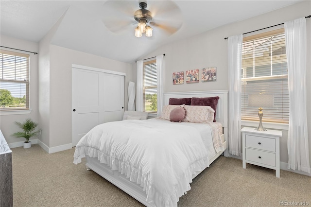 13729 Vallejo Loop, Broomfield, CO 80023 - bedroom with light colored carpet, a closet, a ceiling fan, and vaulted ceiling