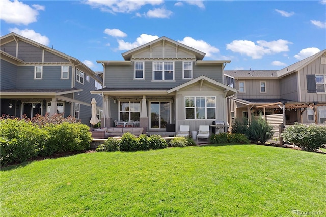 13729 Vallejo Loop, Broomfield, CO 80023 - rear view of house featuring an outdoor hangout area and a lawn