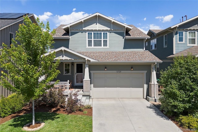 13729 Vallejo Loop, Broomfield, CO 80023 - craftsman house with covered porch, a shingled roof, driveway, an attached garage, and a front lawn