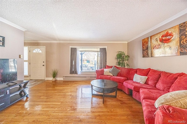 living room with crown molding, hardwood / wood-style flooring, and baseboard heating