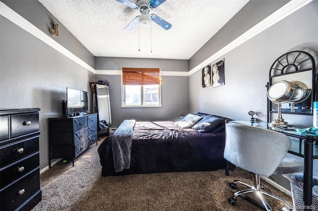 carpeted bedroom featuring ceiling fan and a textured ceiling