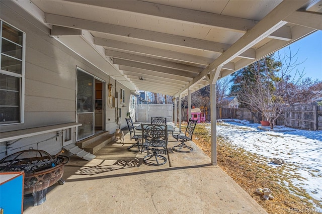 view of snow covered patio