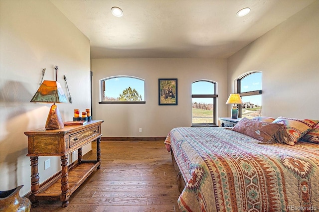 bedroom featuring baseboards, recessed lighting, and wood-type flooring