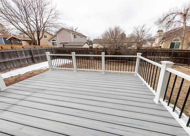 deck featuring a fenced backyard and a residential view