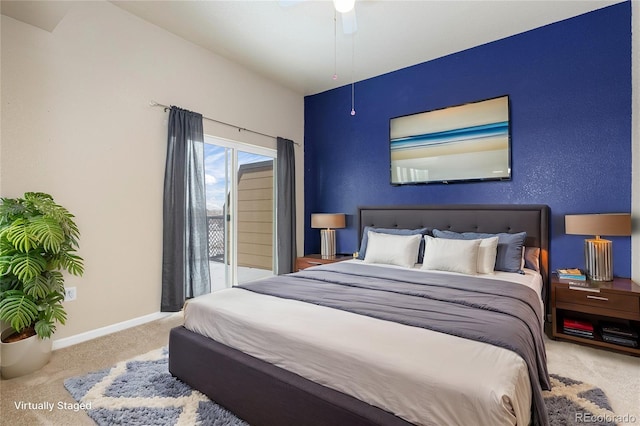 bedroom featuring ceiling fan and carpet