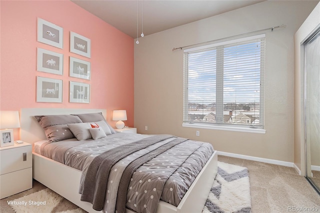 bedroom with light colored carpet