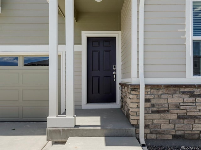 2717 73rd Avenue Ct, Greeley, CO 80634 - doorway to property with a garage