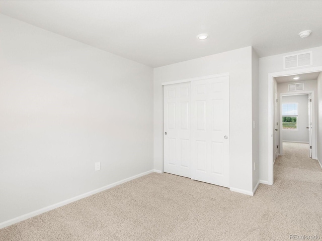 2717 73rd Avenue Ct, Greeley, CO 80634 - unfurnished bedroom with light carpet, baseboards, a closet, and recessed lighting
