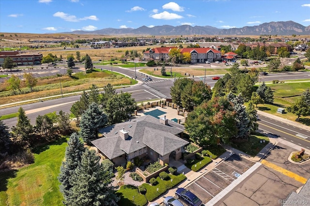 birds eye view of property with a mountain view