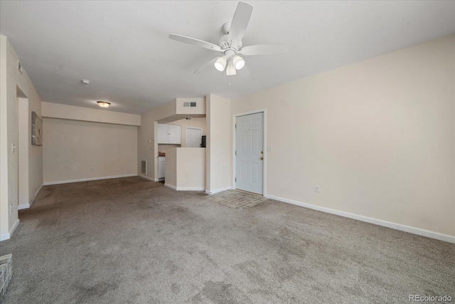 unfurnished living room featuring visible vents, carpet floors, a ceiling fan, and baseboards