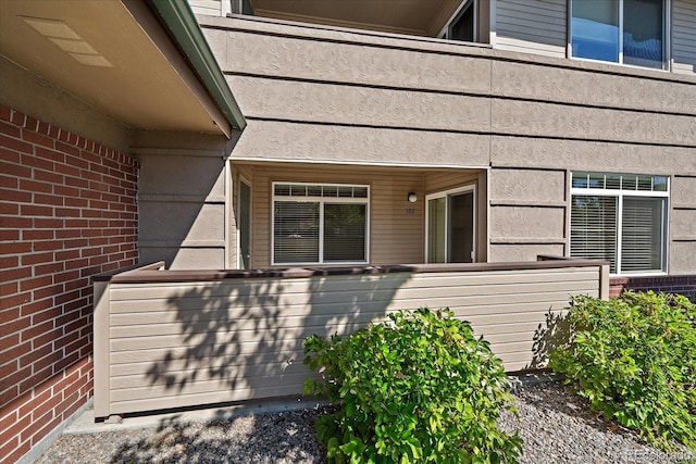 exterior space with brick siding