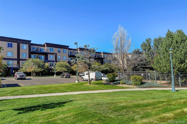 view of property's community featuring a yard