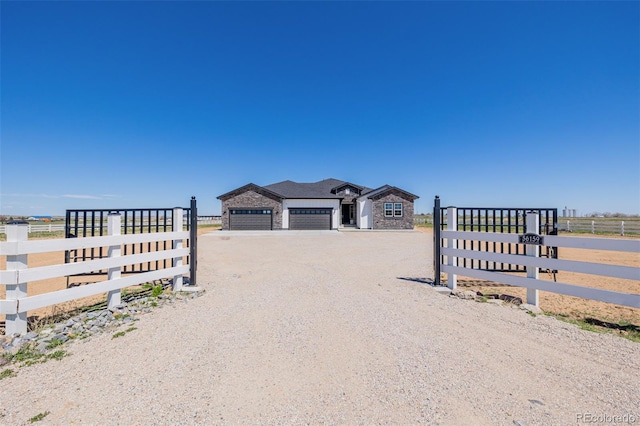 56159 E Tomahawk Ave, Strasburg, CO 80136 - view of dirt / gravel driveway with a gated entry