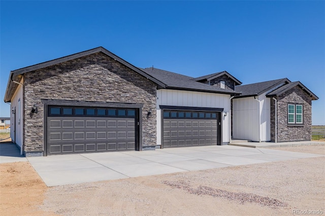 56159 E Tomahawk Ave, Strasburg, CO 80136 - modern farmhouse with an attached garage, stone siding, and concrete driveway