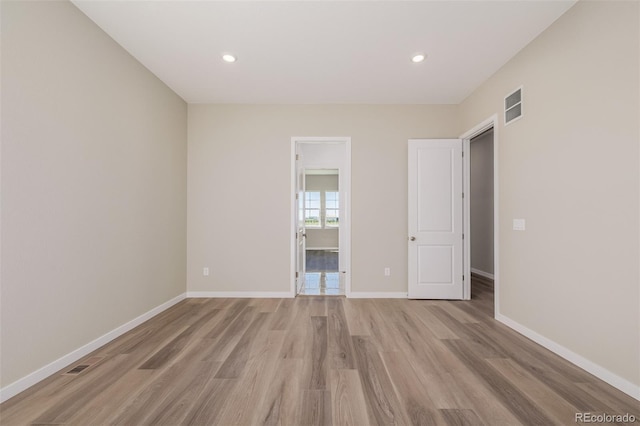 56159 E Tomahawk Ave, Strasburg, CO 80136 - unfurnished room with light wood-style flooring, baseboards, and recessed lighting