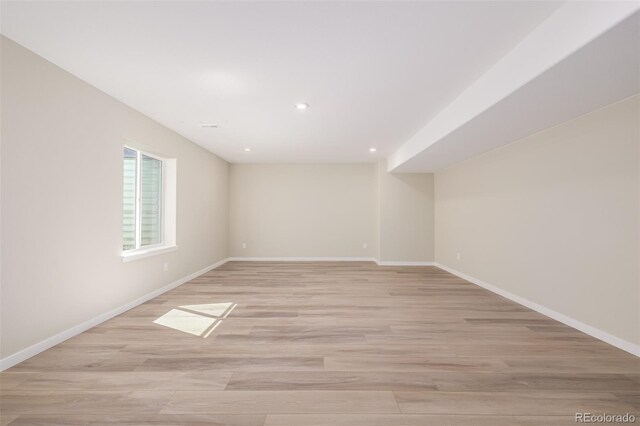 56159 E Tomahawk Ave, Strasburg, CO 80136 - spare room featuring baseboards, light wood-type flooring, and recessed lighting