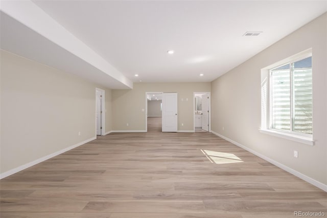 56159 E Tomahawk Ave, Strasburg, CO 80136 - spare room featuring baseboards, light wood-style flooring, and recessed lighting