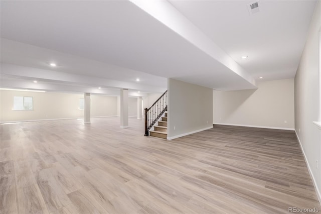 56159 E Tomahawk Ave, Strasburg, CO 80136 - basement with stairs, baseboards, light wood-type flooring, and recessed lighting