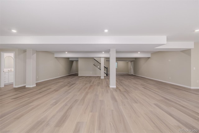 56159 E Tomahawk Ave, Strasburg, CO 80136 - finished basement with recessed lighting, baseboards, light wood finished floors, and stairs