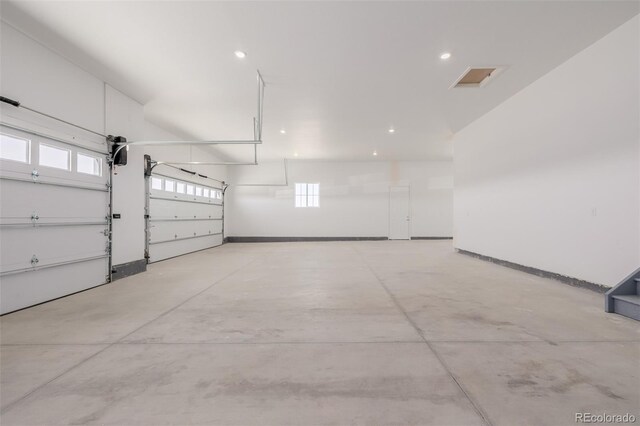56159 E Tomahawk Ave, Strasburg, CO 80136 - garage with recessed lighting and baseboards