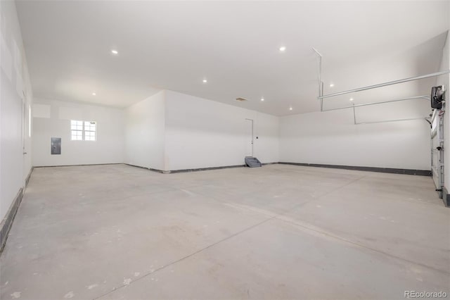 56159 E Tomahawk Ave, Strasburg, CO 80136 - garage with electric panel, recessed lighting, and baseboards
