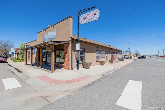 56159 E Tomahawk Ave, Strasburg, CO 80136 - view of asphalt road with sidewalks and curbs