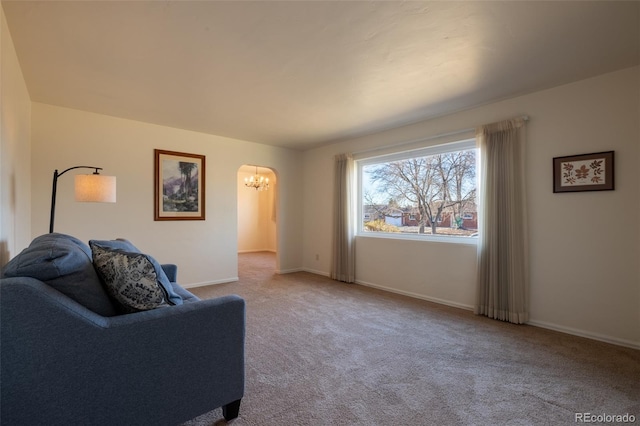 971 Elm Pl, Thornton, CO 80229 - carpeted living room featuring a chandelier and baseboards