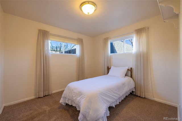971 Elm Pl, Thornton, CO 80229 - carpeted bedroom featuring multiple windows and baseboards