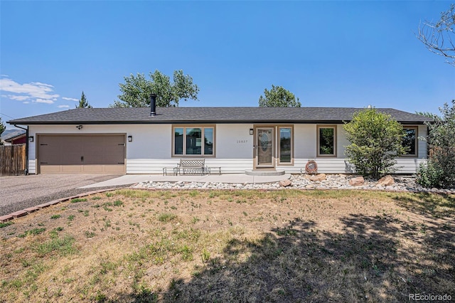 single story home featuring a garage