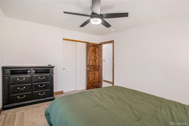 bedroom with carpet flooring, a closet, and ceiling fan