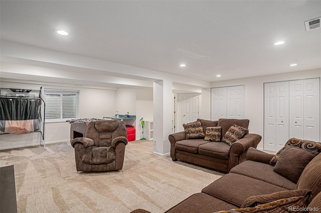 living room featuring light carpet