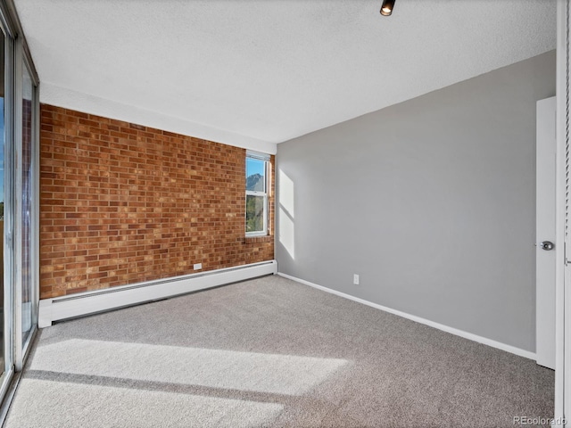 850 20th St Unit 503, Boulder, CO 80302 - empty room with a baseboard radiator, carpet flooring, baseboards, and brick wall