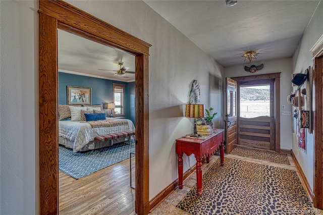 foyer with a healthy amount of sunlight, ceiling fan, and hardwood / wood-style floors