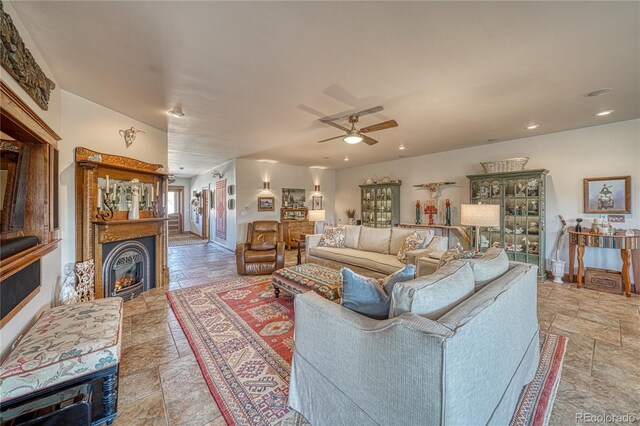 living room with ceiling fan and light tile floors