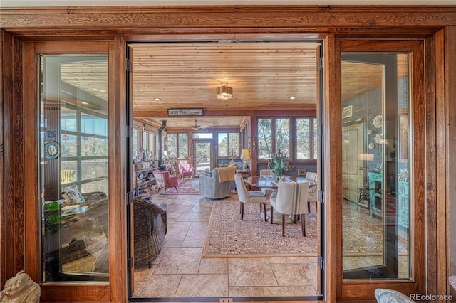 sunroom / solarium featuring wooden ceiling