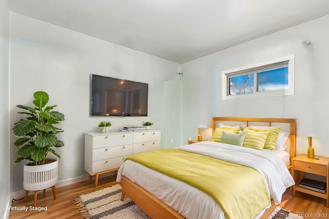 bedroom with light wood-type flooring