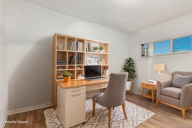 office space with light wood-type flooring